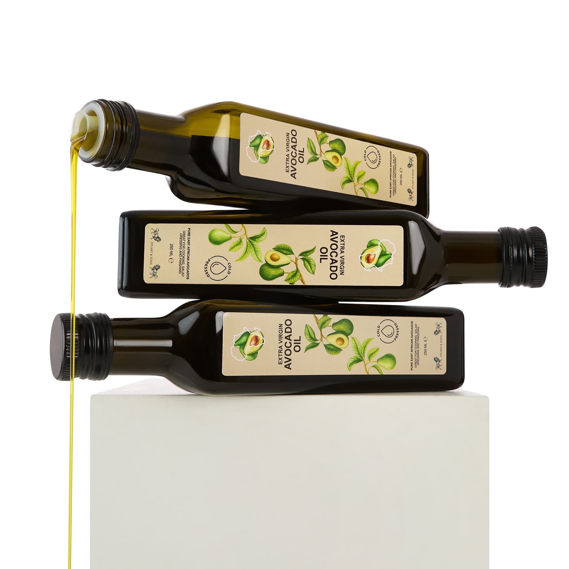 Styled food and drink packshot - art-directed bottle pour imagery UK