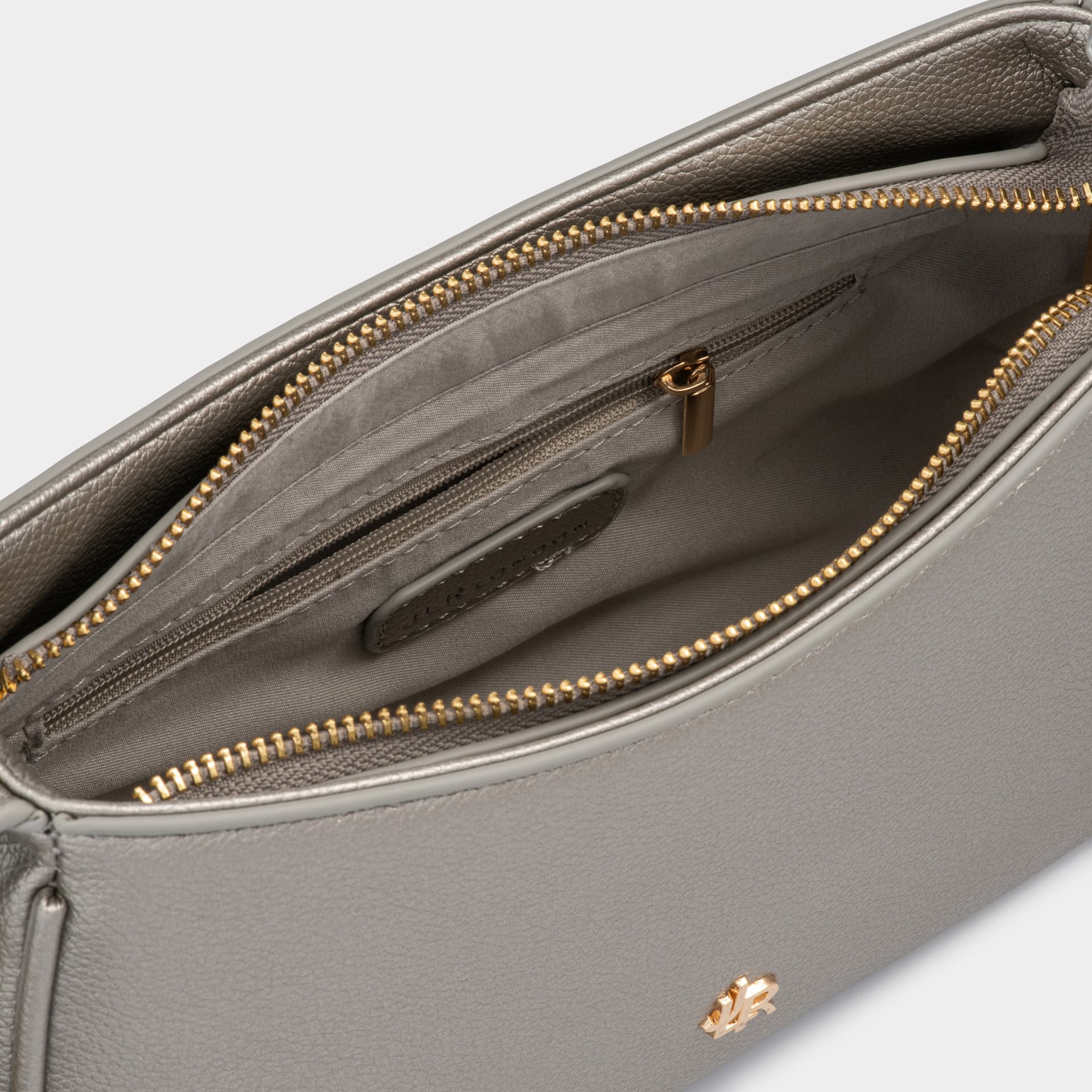 Bag materials and detail - leather grain, stitching and hardware photography UK