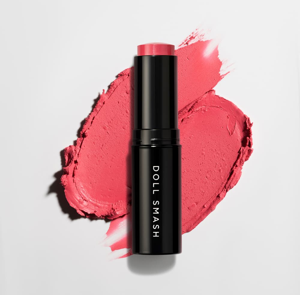 Beauty product styled in a warm lifestyle setting with props