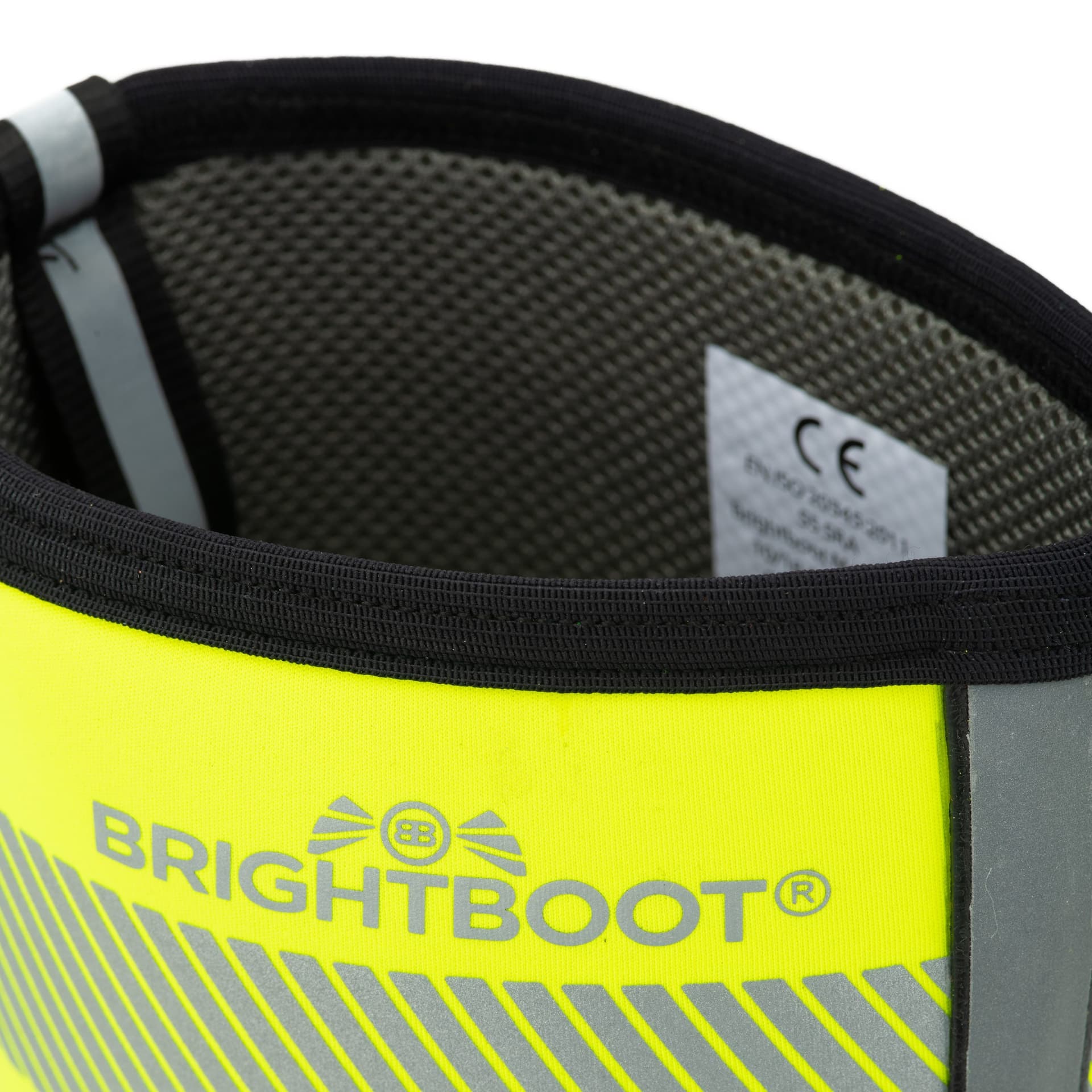 Close-up of a yellow and grey safety boot opening showing its lining and internal label